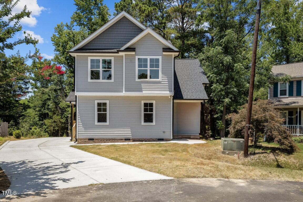 a house with trees in the background