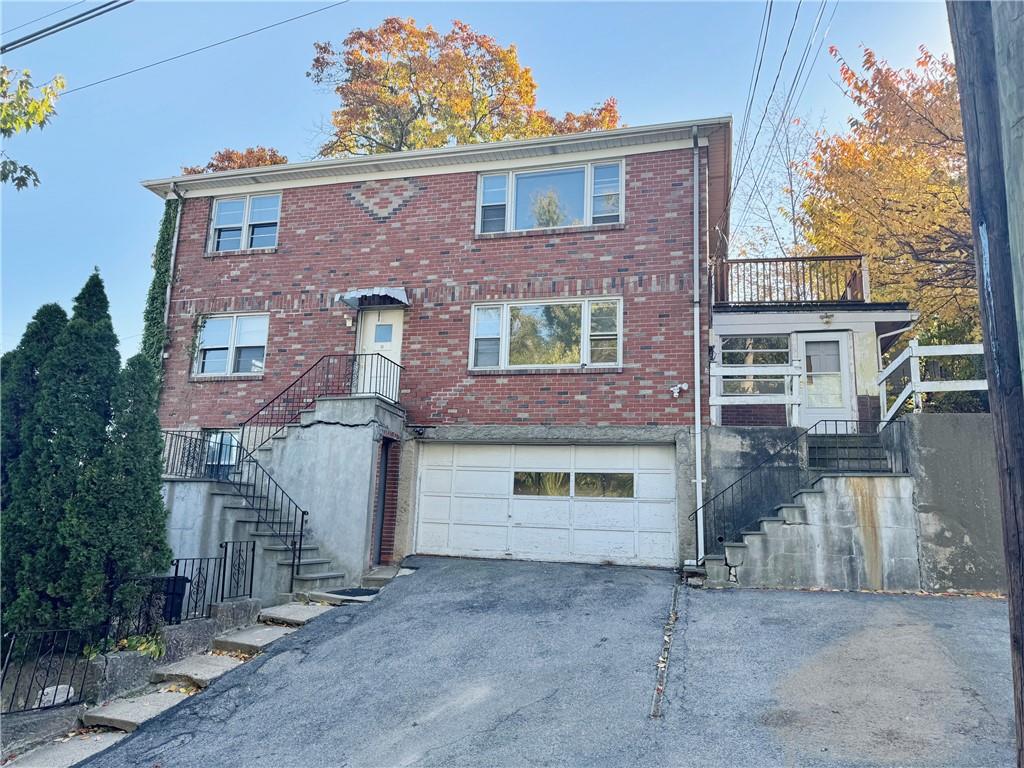 View of front of home with a garage