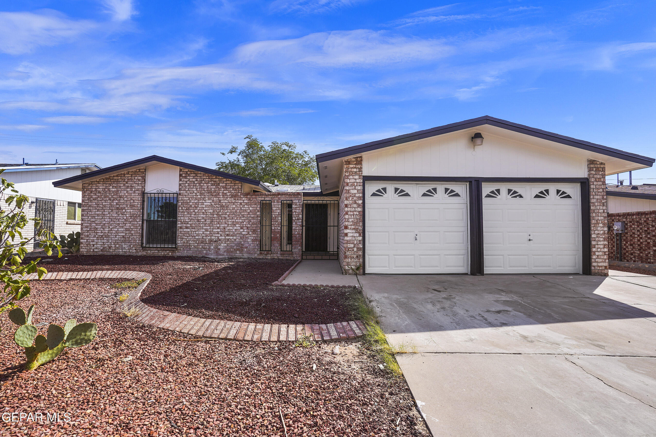 a front view of a house with a garage