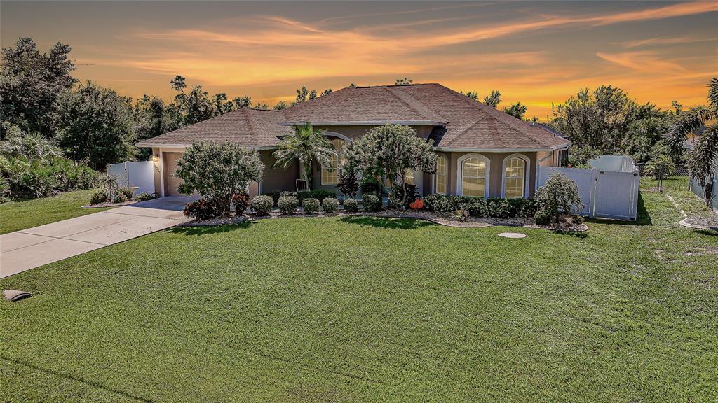 a front view of house with yard and outdoor seating