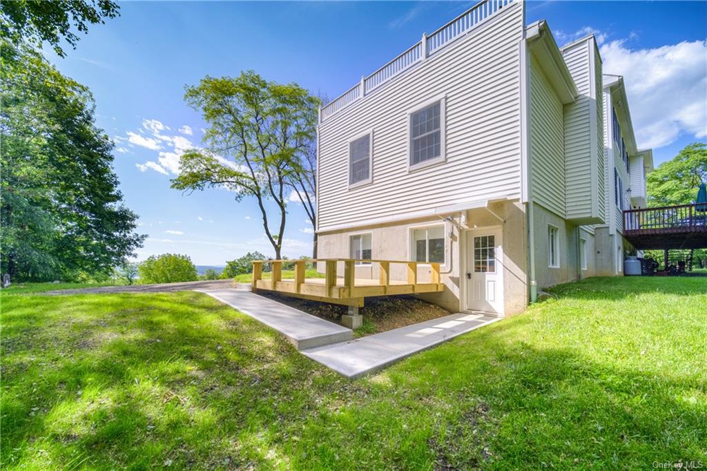 a front view of house with yard and outdoor seating