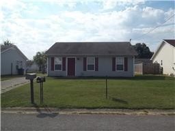 a view of a yard in front of a house