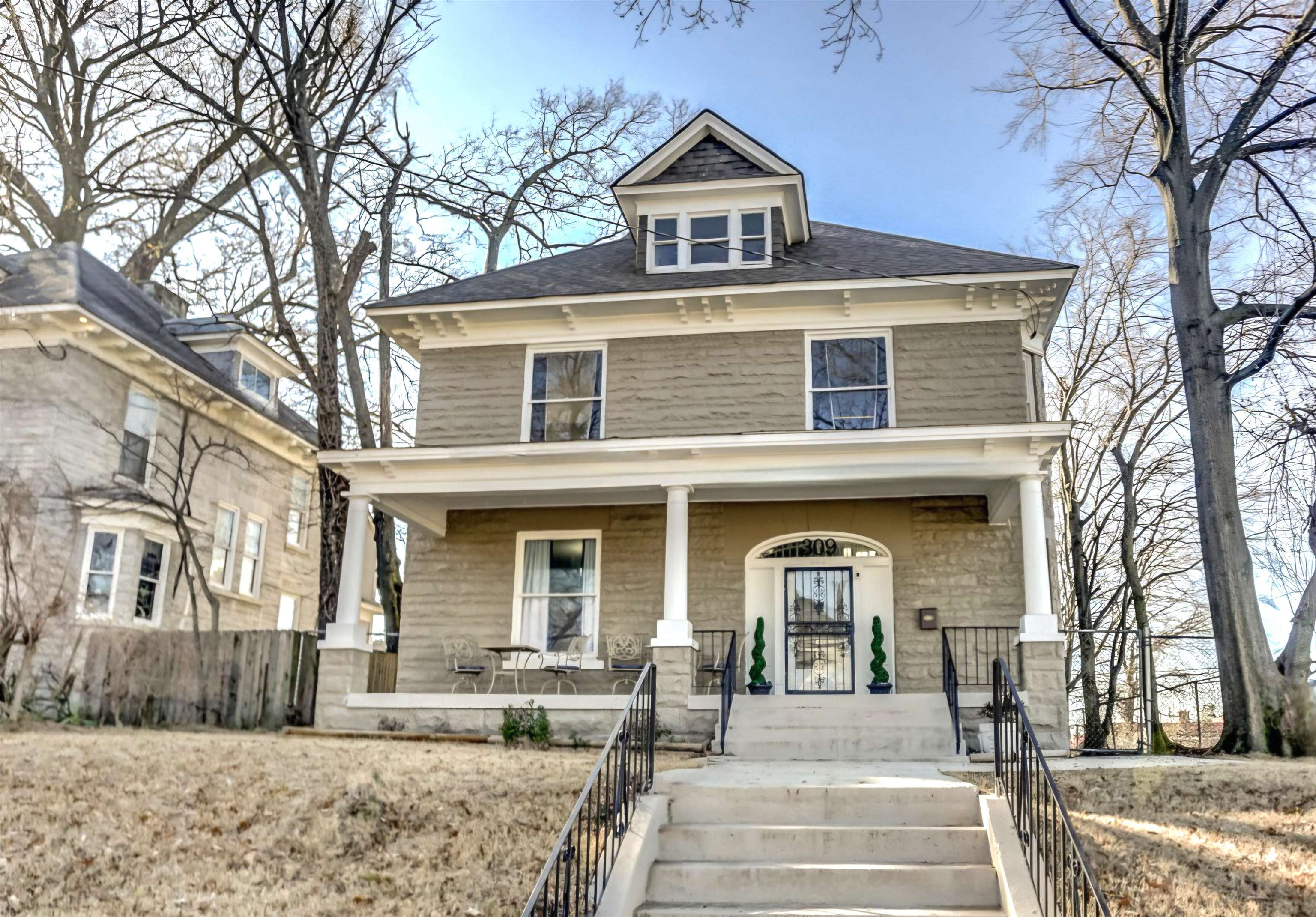 a front view of a house with a yard