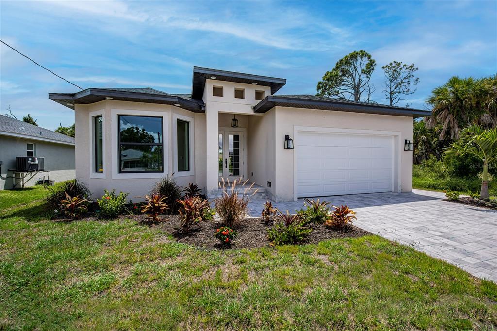 front view of a house with a yard