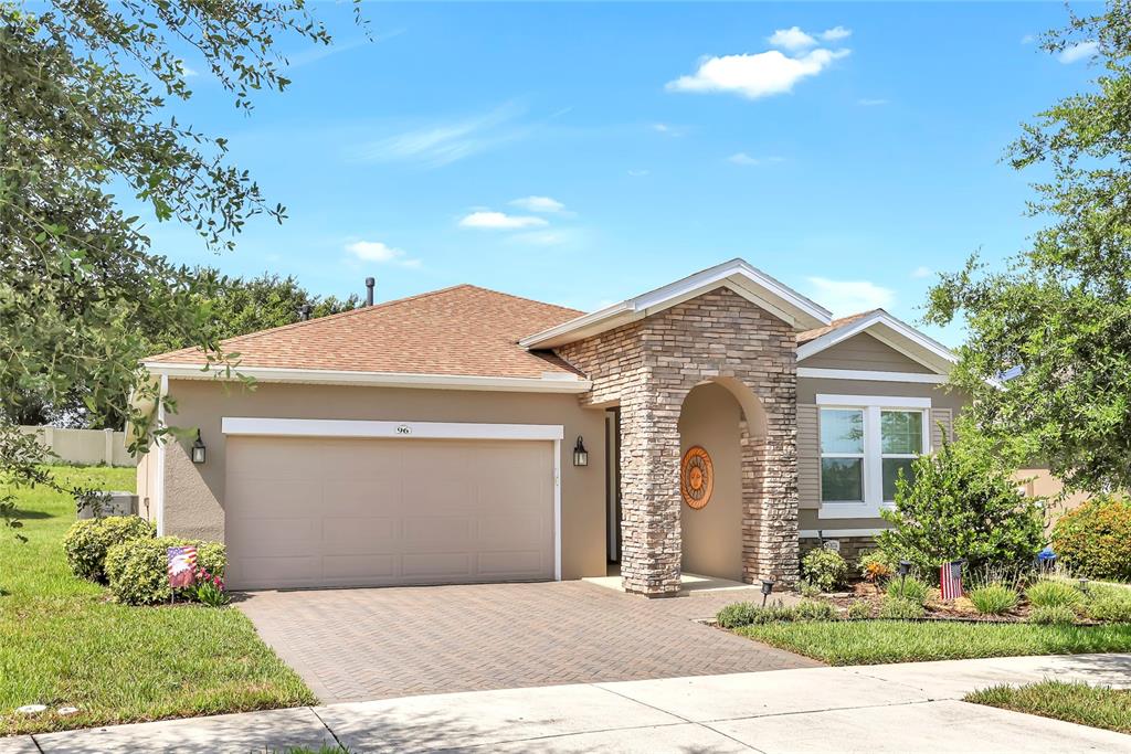 a front view of a house with yard