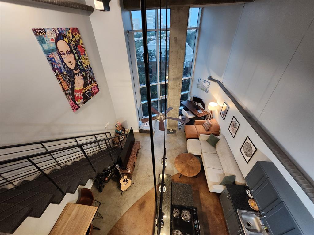 wooden floor with table and chairs