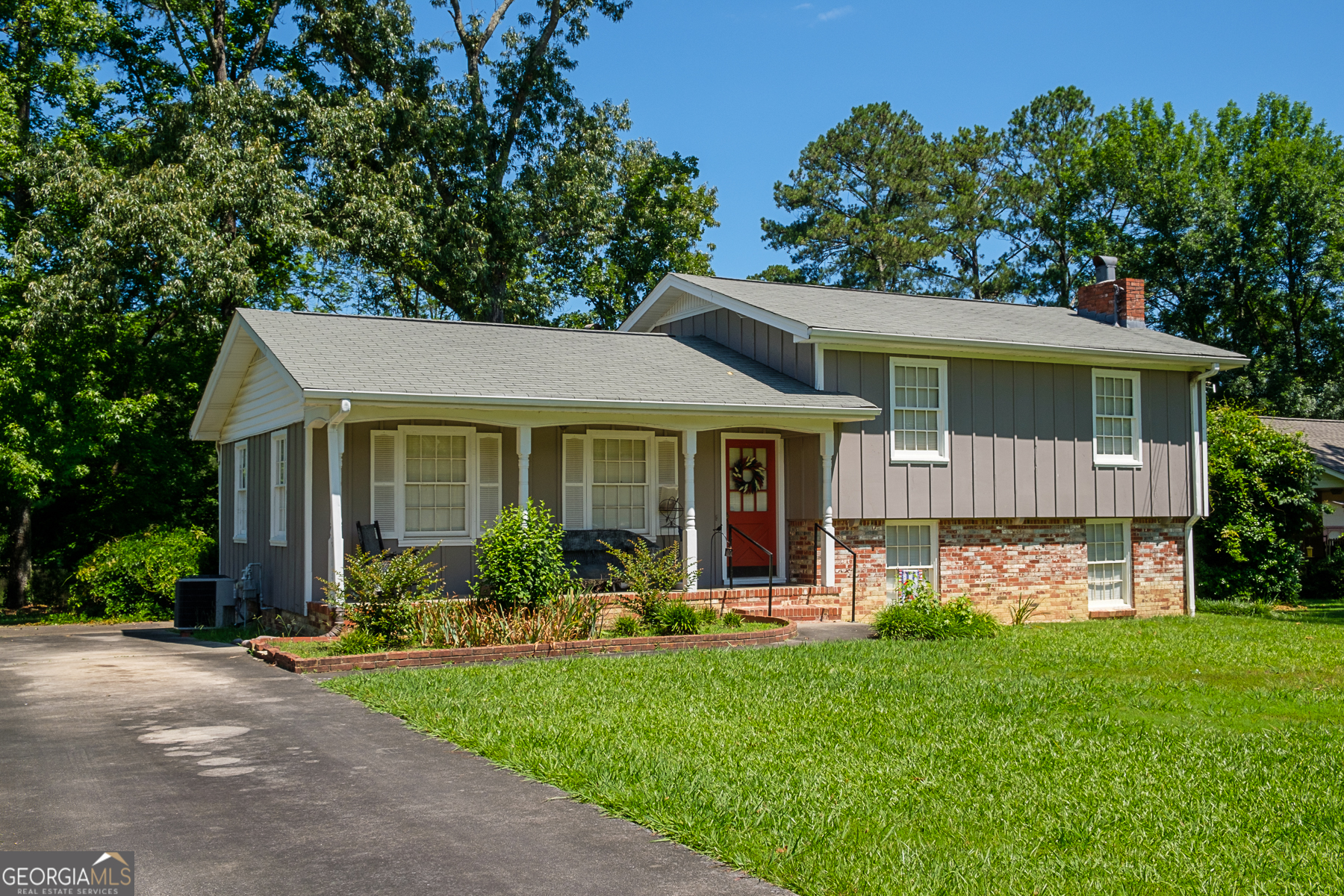 front view of a house with a yard