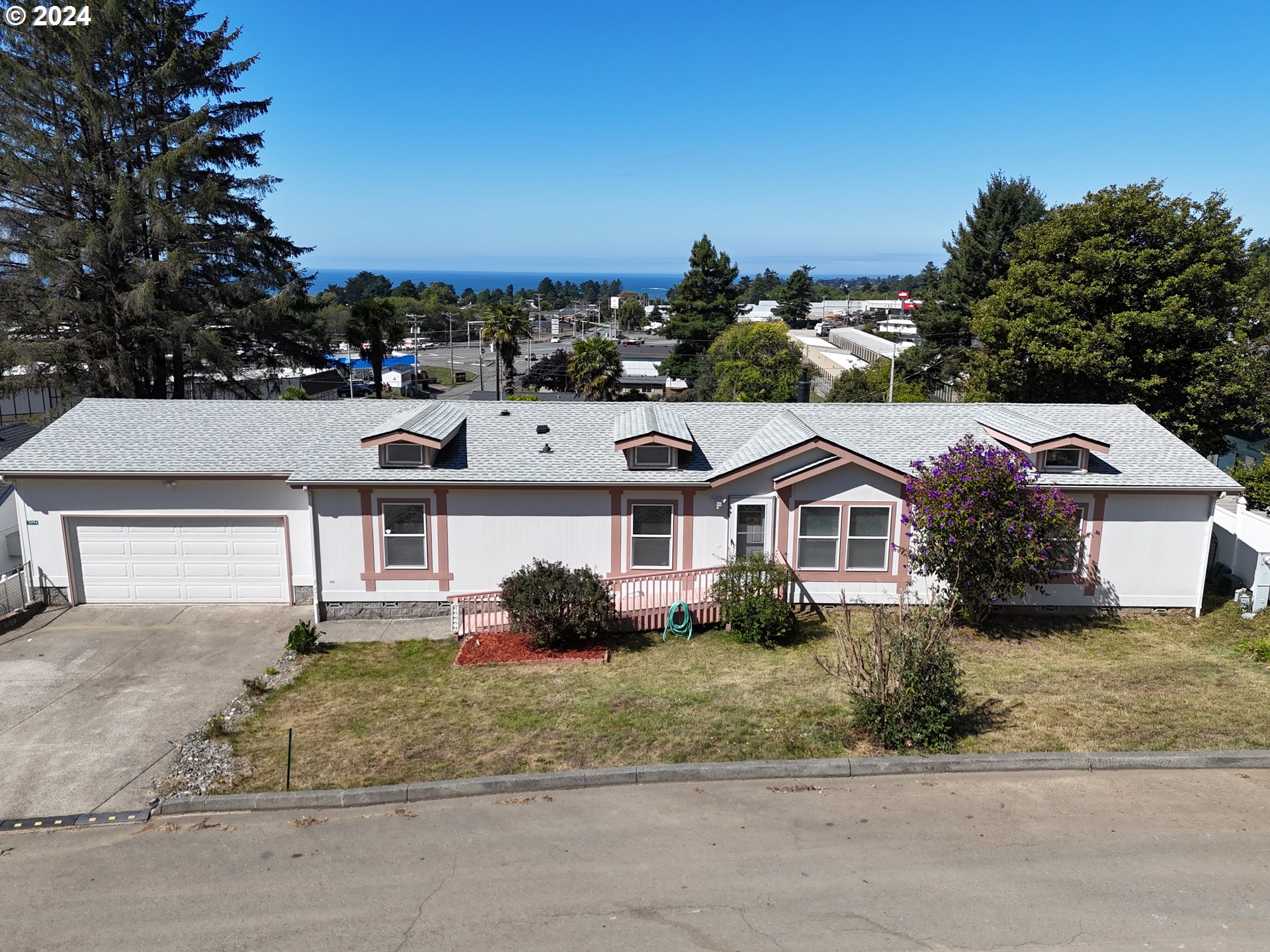 front view of a house with a yard