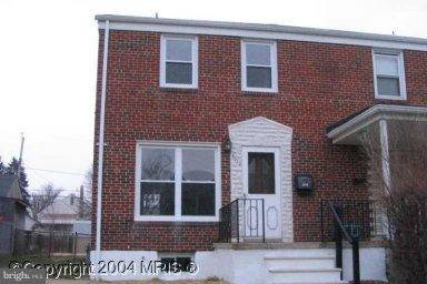 a front view of a house with large windows