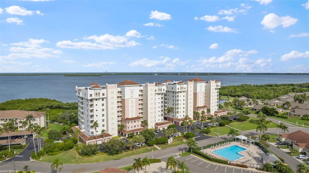 a view of a balcony with lake view and mountain view