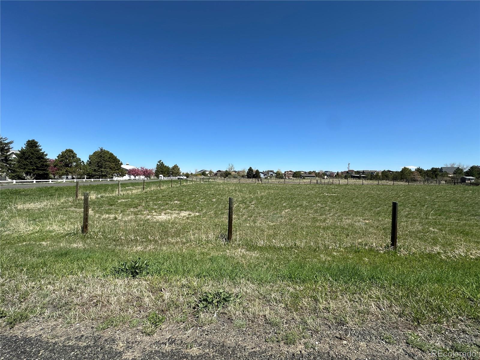 a view of a lake with a yard