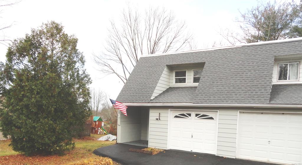 a front view of a house with a garage