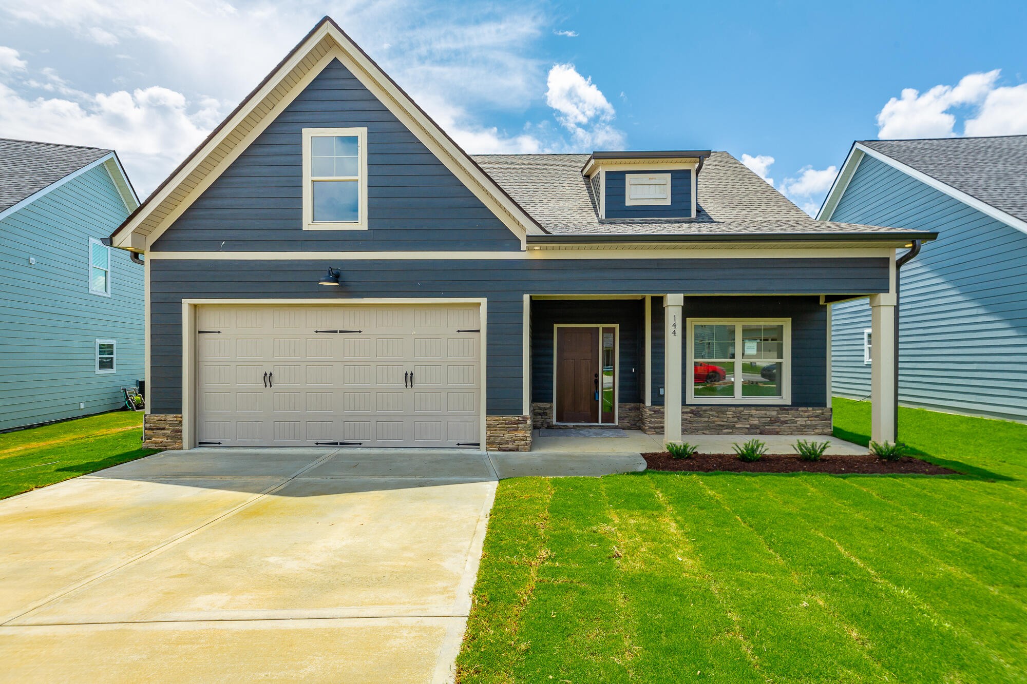 a front view of a house with a yard