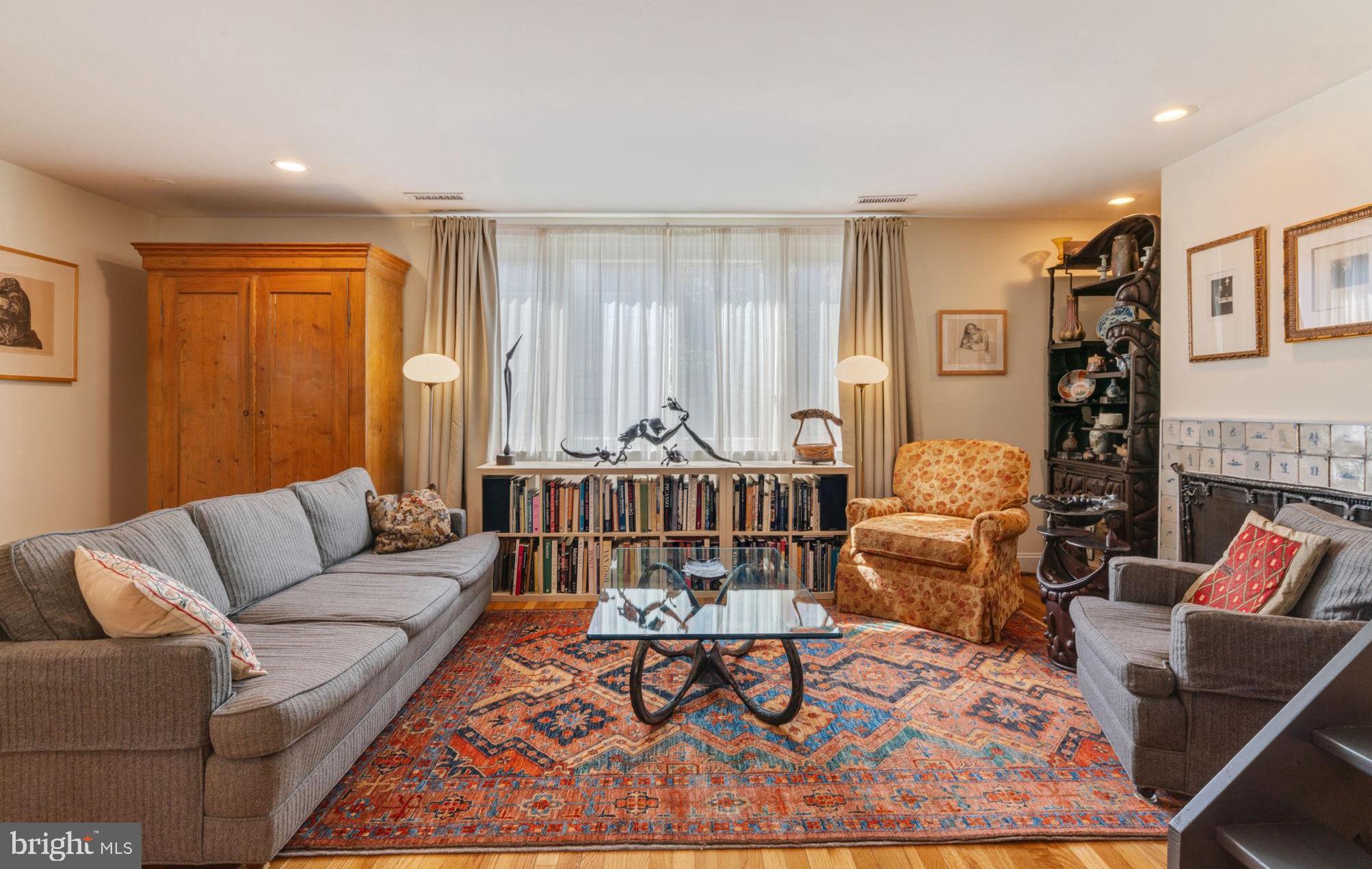 a living room with furniture and a rug