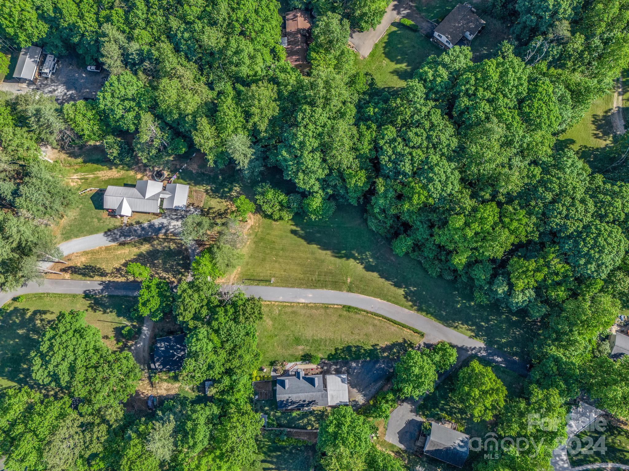 an aerial view of a house with yard