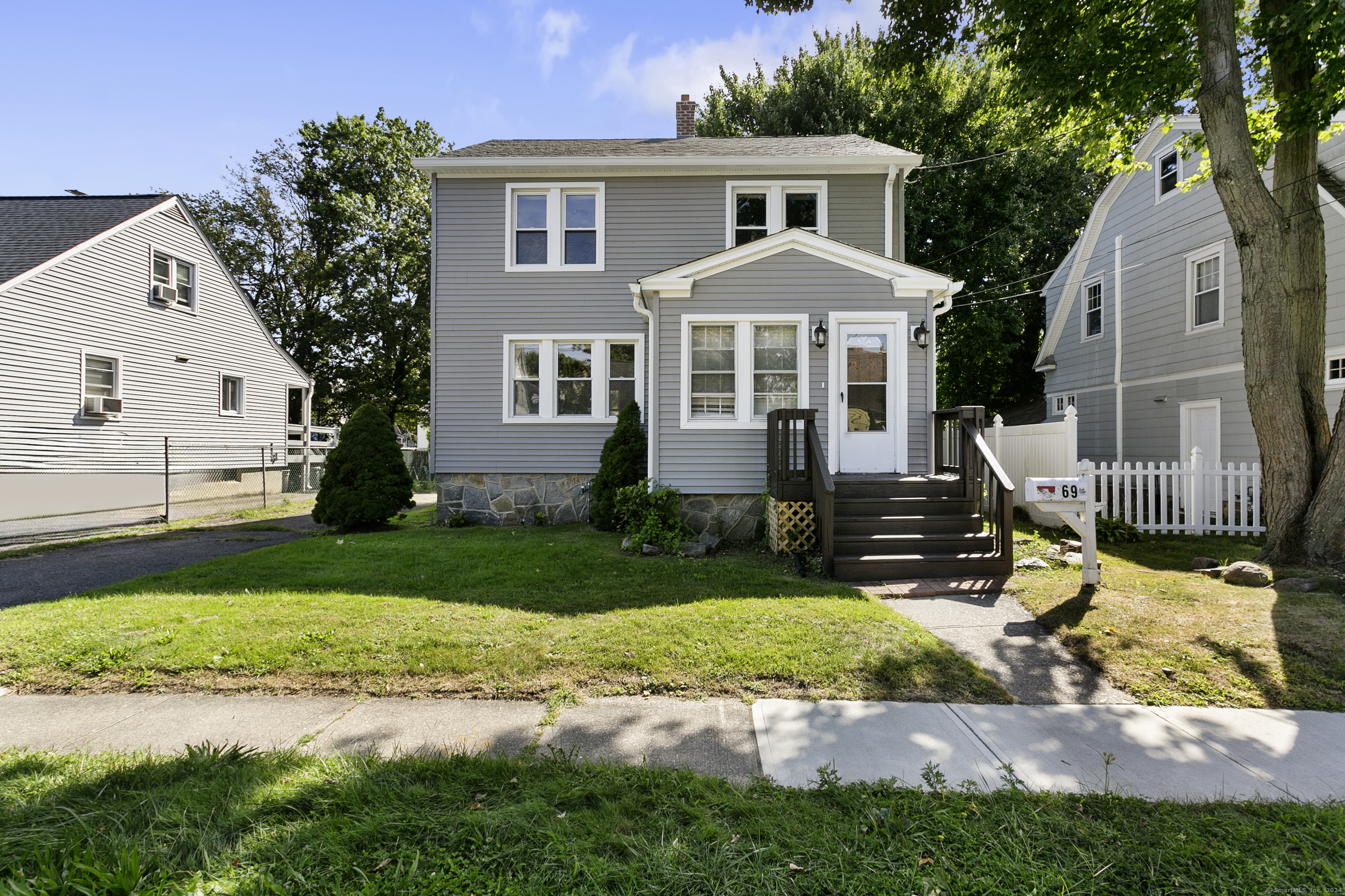 a front view of a house with a yard patio and fire pit