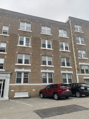 a cars parked in front of a building