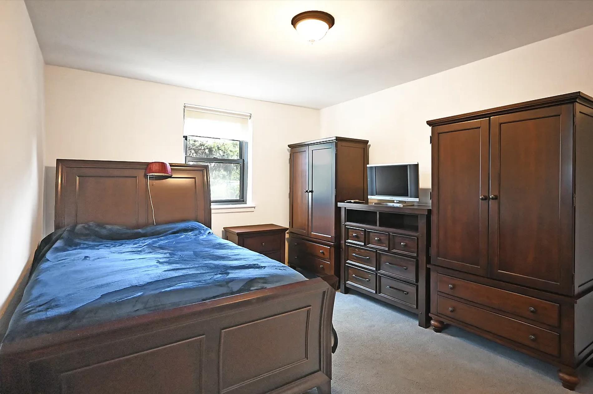 a kitchen with kitchen island cabinets and refrigerator