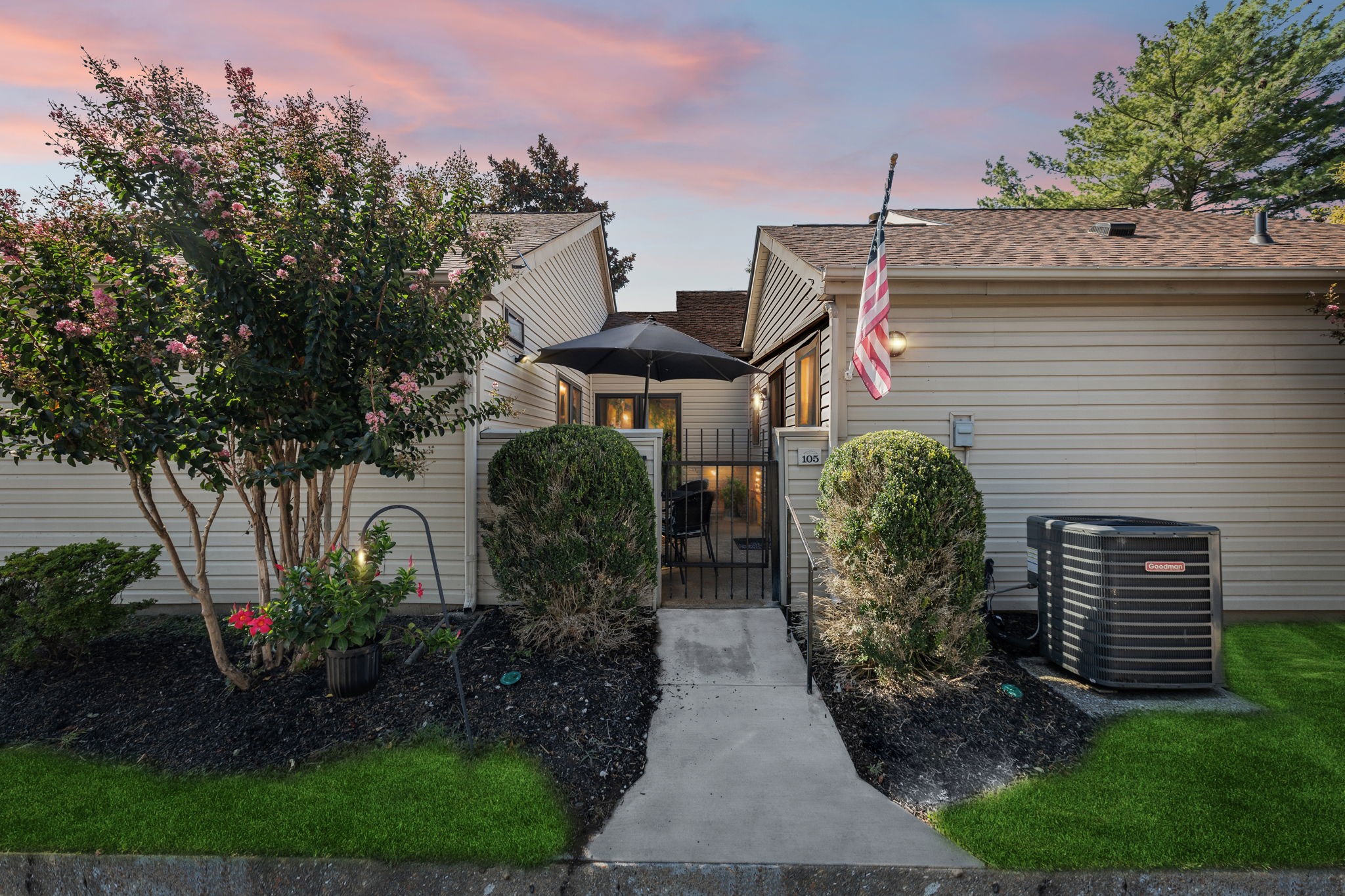 a front view of a house with garden