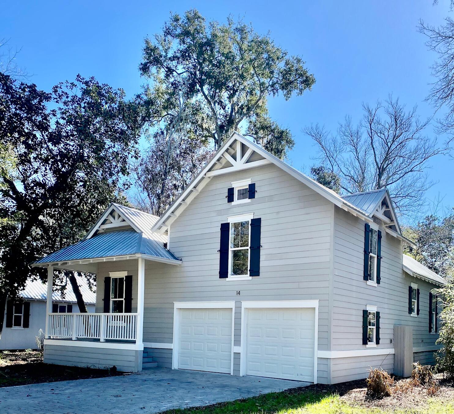 a house that has a tree in front of the house