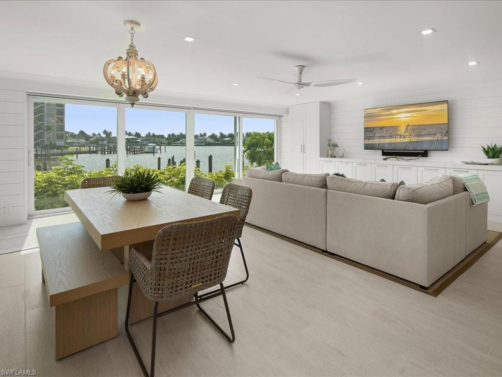 a view of a dining room with furniture window and outside view