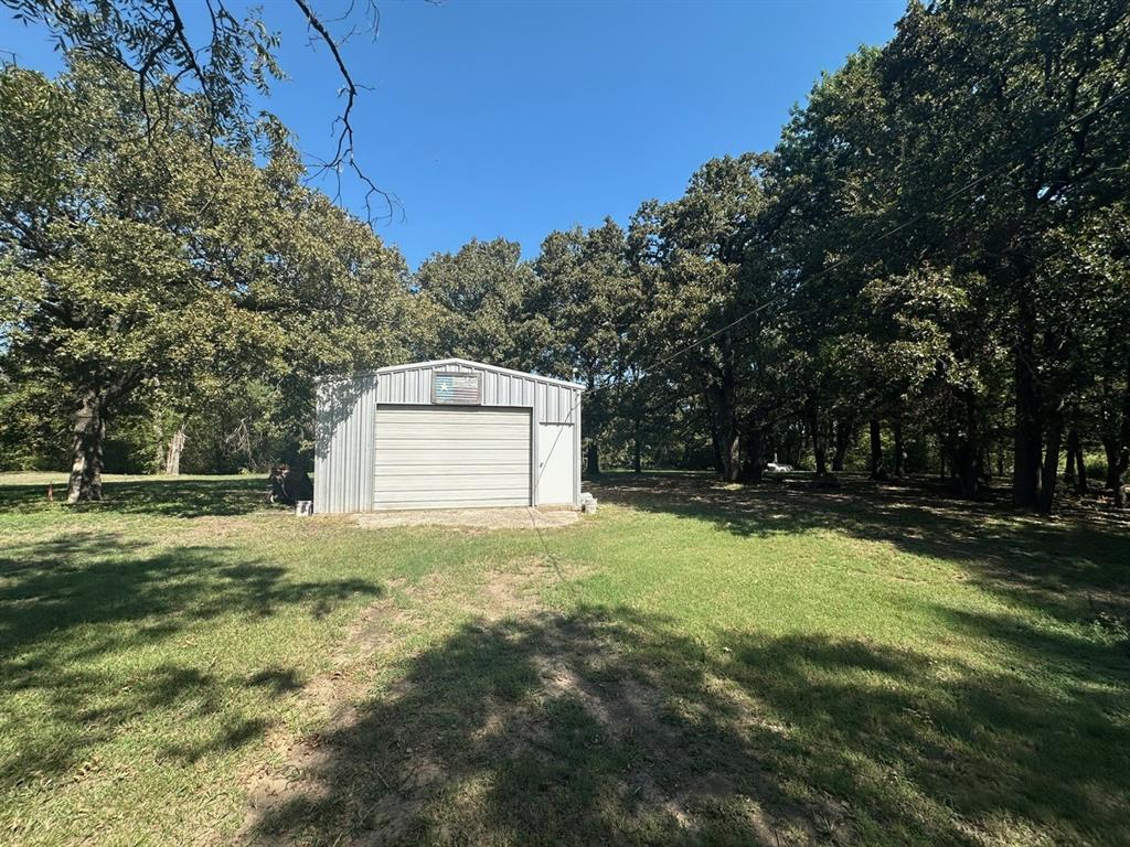 a view of backyard with green space