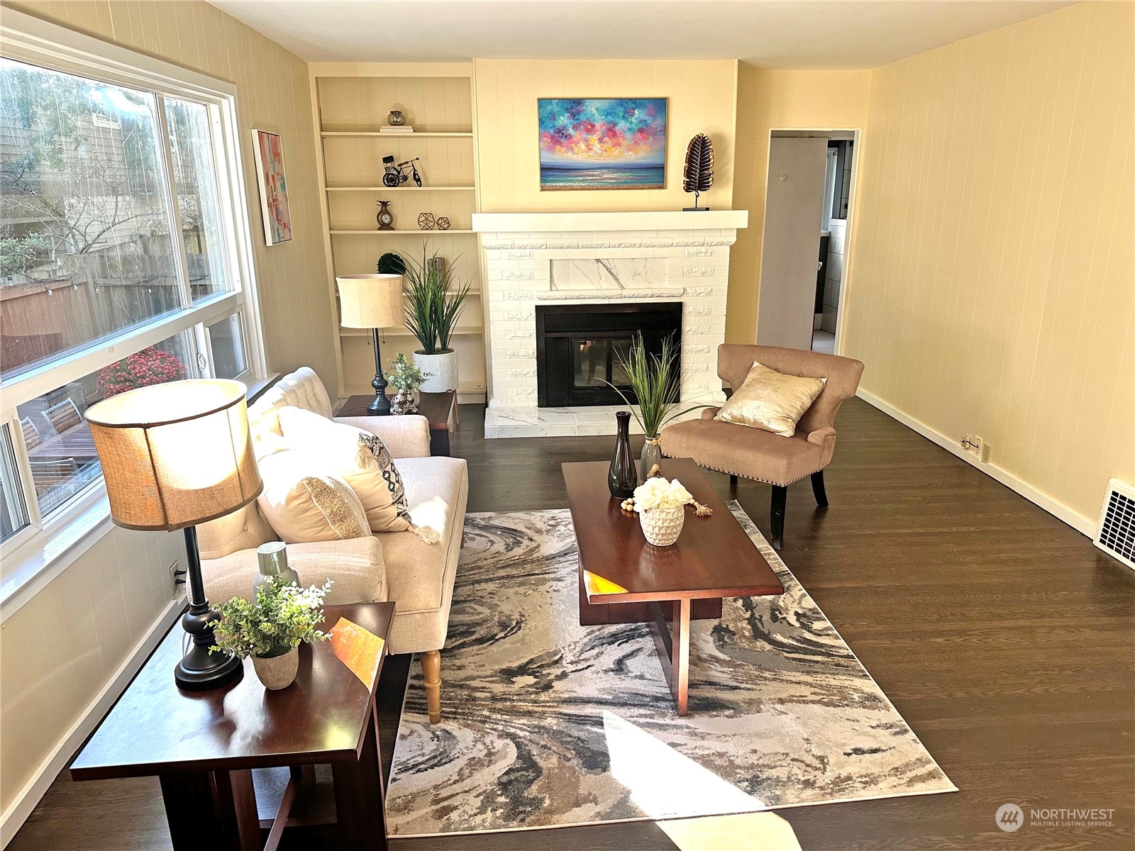 a living room with furniture and a fireplace