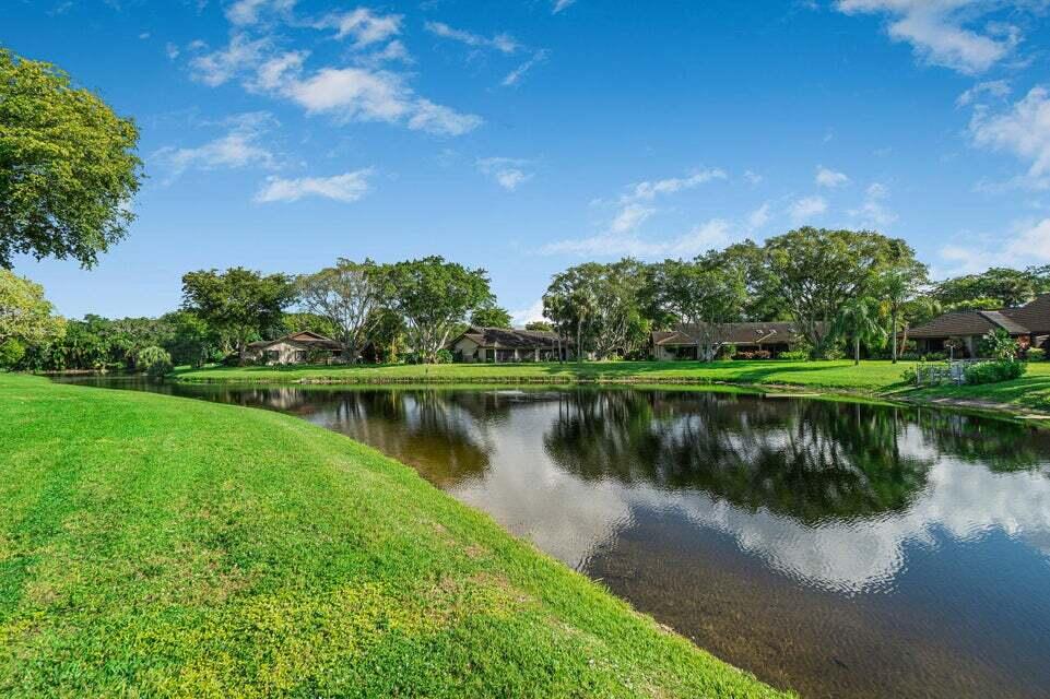 a view of a lake with a house in the background