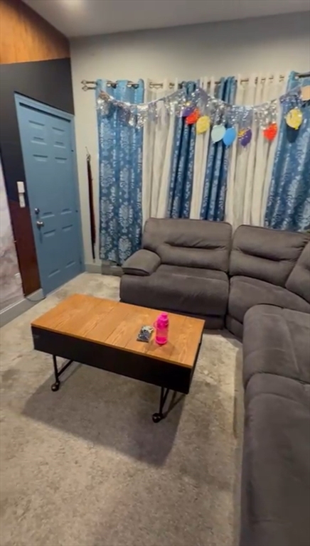 a living room with furniture and a couch