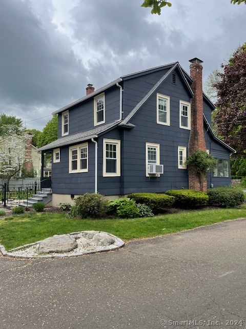 Side of house facing Brookside Place, and back entry from driveway.