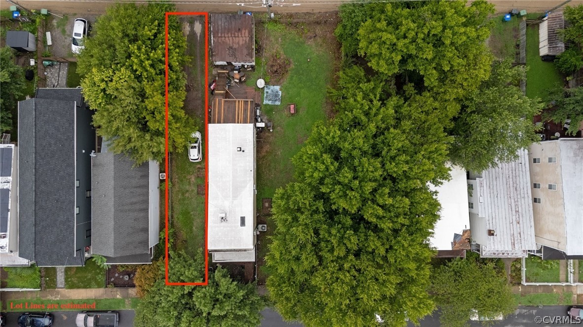 an aerial view of residential house with outdoor space and trees