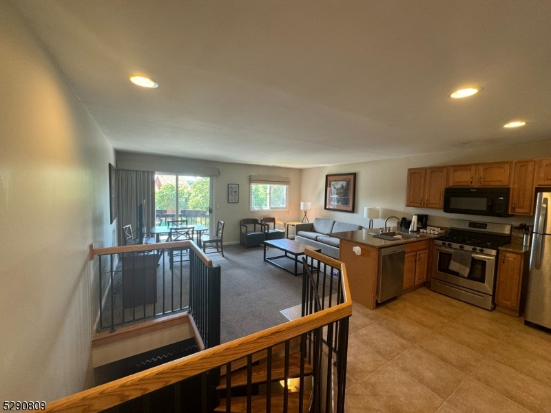 a view of a living room and kitchen