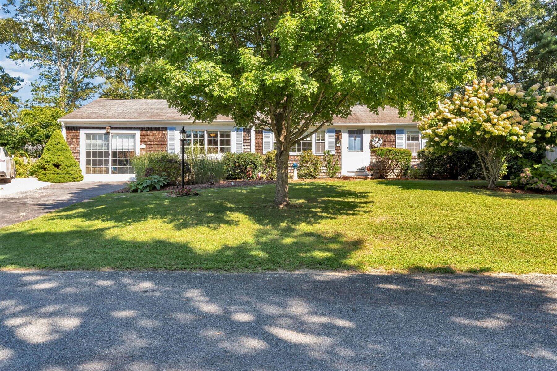 a front view of a house with a yard