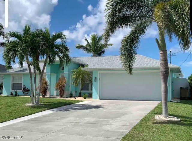 a front view of house with yard and green space