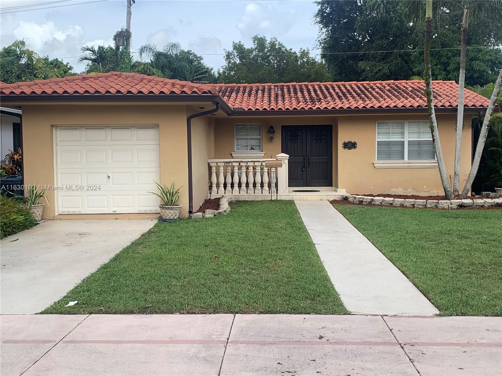 a view of a house with a yard