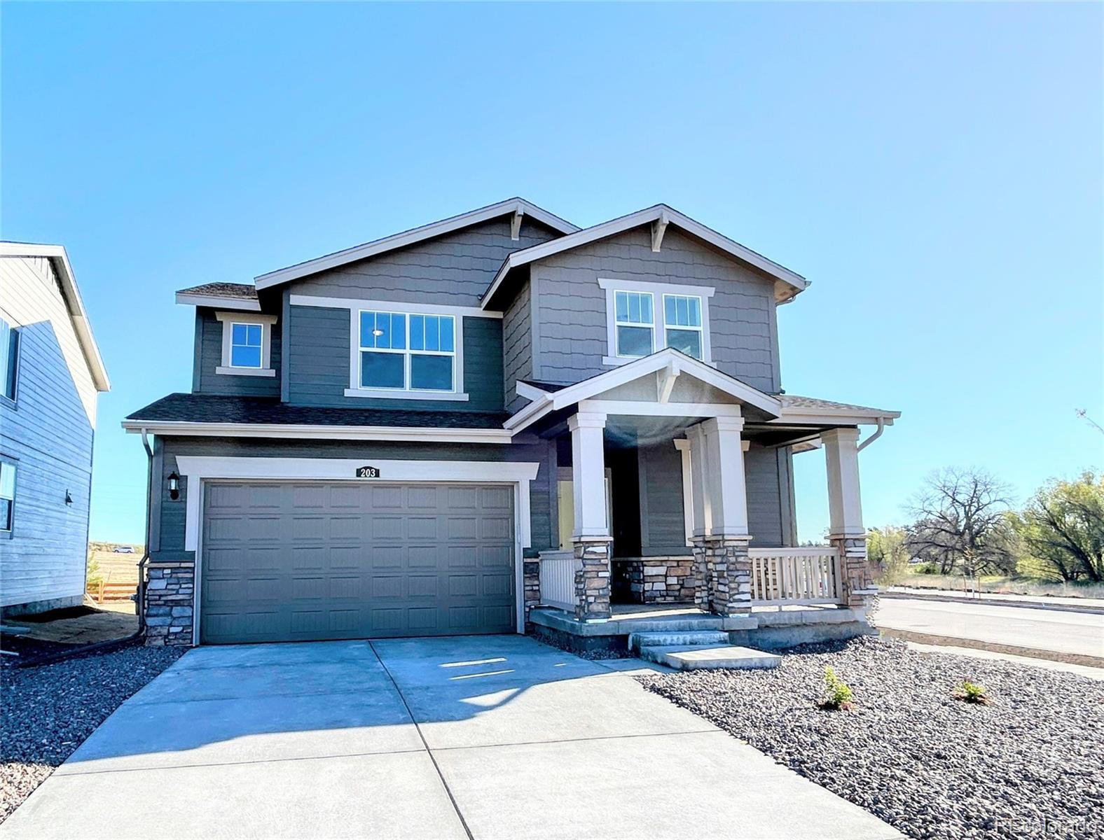 a front view of a house with yard