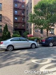 a car parked in front of a brick house