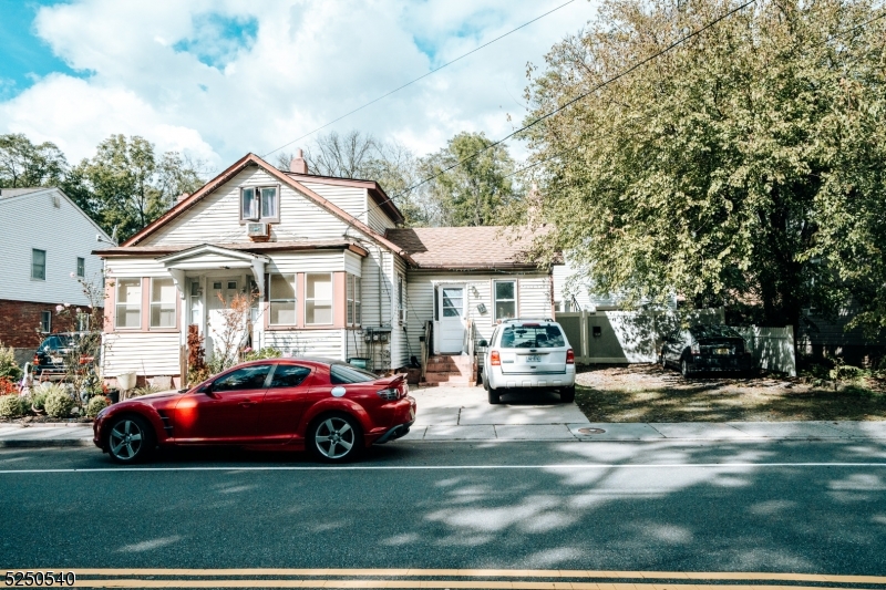 a view of a car parked in front of a house