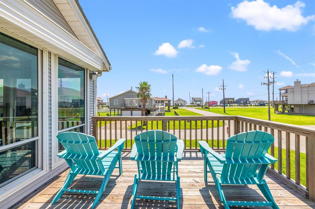 a view of a chairs and table on the deck