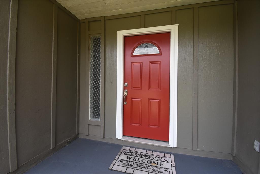 a door view with a red door