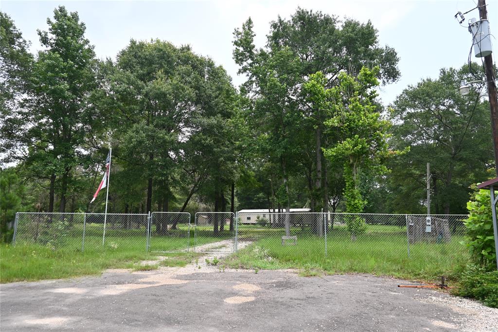 a backyard of a house and trees