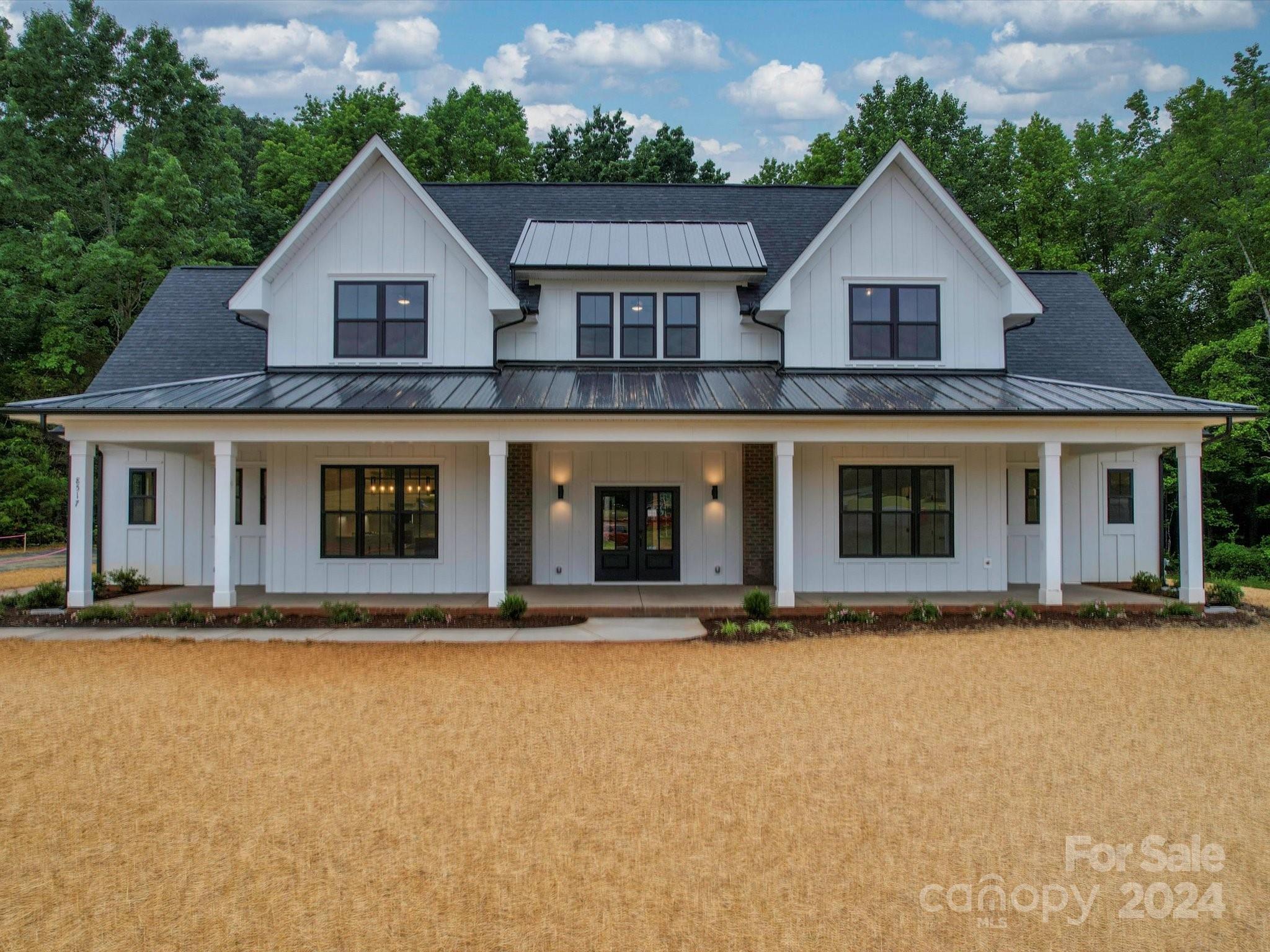 a front view of a house with yard