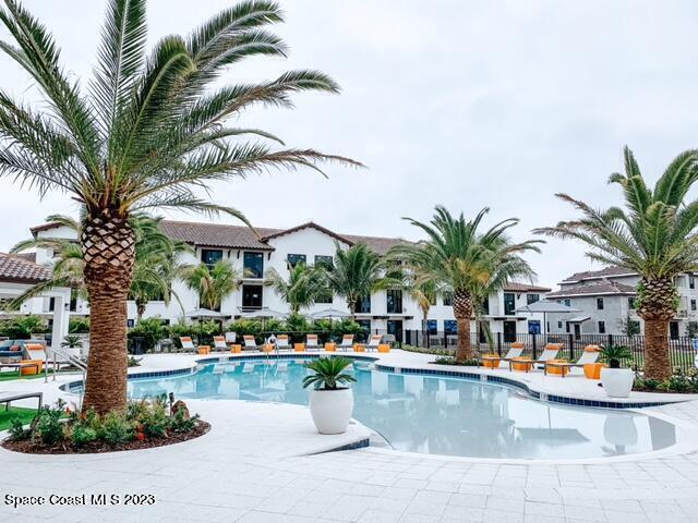 a view of a swimming pool and lounge chair