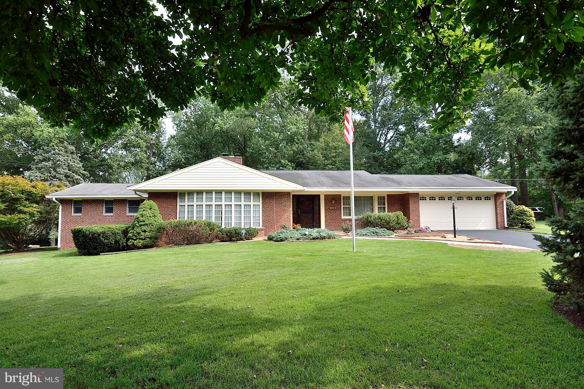 a front view of a house with yard porch and green space