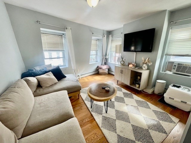 a living room with furniture and a flat screen tv