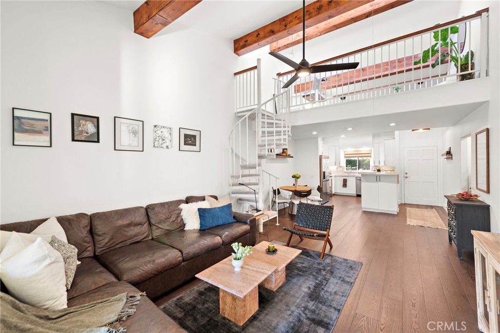 High ceilings & spiral stairs to the added loft