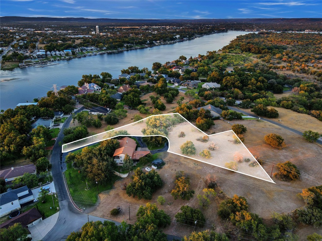 an aerial view of a house with a lake view