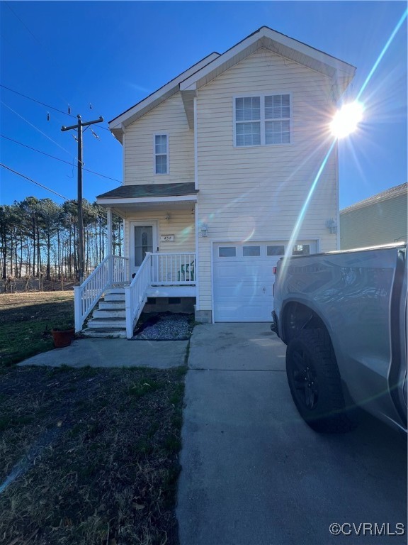 View of front facade featuring a garage