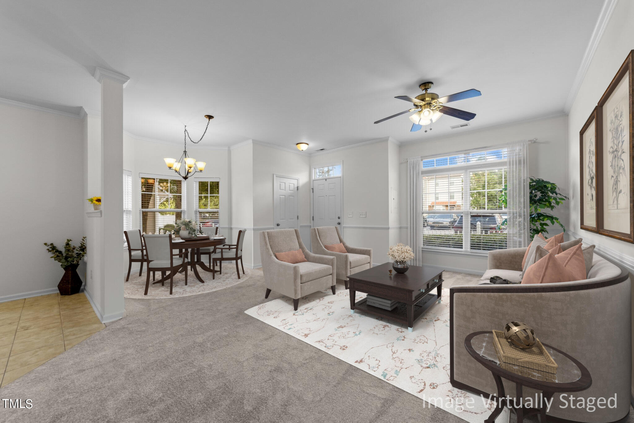 a living room with furniture potted plant and a chandelier