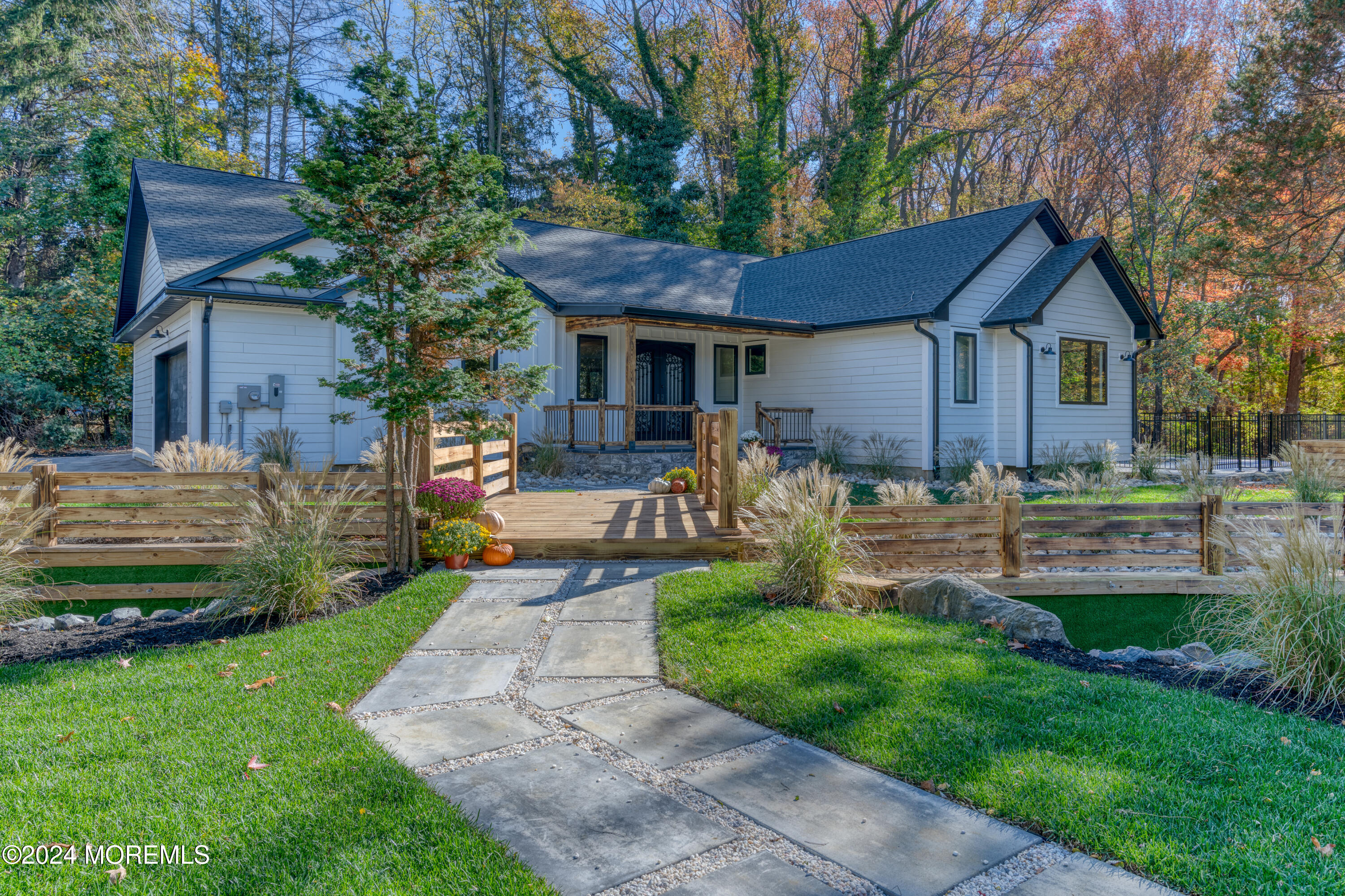 a front view of a house with a yard table and chairs